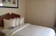 Kamar Tidur 7 Days Inn & Suites by Wyndham Denver International Airport