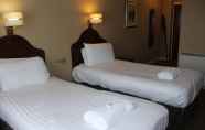 Kamar Tidur 7 The Cairn Hotel