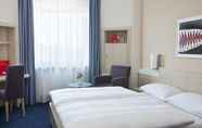 Phòng ngủ 4 IntercityHotel Ulm