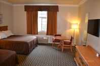 Phòng ngủ The Miramar Inn & Suites