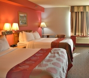 Bedroom 6 Ramada by Wyndham Sioux Falls Airport-Waterpark & Event Ctr