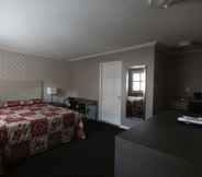 Bedroom 5 Alpha Inn & Suites