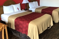 Bedroom Econo Lodge & Suites