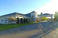 Bangunan American Inn and Suites Houghton Lake