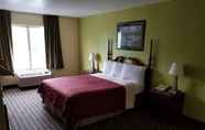 Bedroom 6 Travelodge by Wyndham Lansing IL