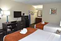 Bedroom Days Inn & Suites by Wyndham Orlando Airport