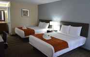 Bedroom 5 Days Inn & Suites by Wyndham Orlando Airport