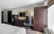 Bedroom 6 Clarion Inn & Suites DFW North