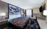 Bedroom 4 Super 8 by Wyndham Kansas City at Barry Road/Airport