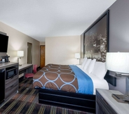 Bedroom 5 Super 8 by Wyndham Kansas City at Barry Road/Airport