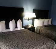 ห้องนอน 7 Days Inn & Suites by Wyndham Peachtree Corners/Norcross