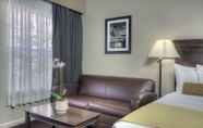 Bedroom 6 University Park Inn & Suites