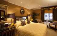 Kamar Tidur 5 The Milestone Hotel