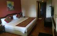 Kamar Tidur 4 Ramee Guestline Hotel Bangalore