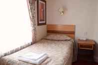 Kamar Tidur Pembridge Palace Hotel