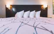 Bedroom 7 Service Plus Inn and Suites - Grande Prairie