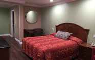 Bedroom 6 American Inn & Suites LAX