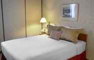 Bilik Tidur 2 Cartier Place Suite Hotel
