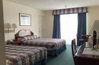 Phòng ngủ Hardman House Inn & Suites
