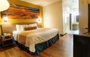 Bedroom 6 Days Inn & Suites by Wyndham Houston North/Aldine