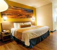 Bedroom 6 Days Inn & Suites by Wyndham Houston North/Aldine