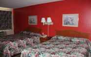 Bedroom 3 Coratel Inn & Suites by Jasper Hastings