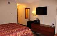Bedroom 6 Coratel Inn & Suites by Jasper Hastings