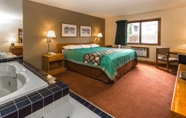 Bedroom 2 Super 8 by Wyndham Hartford WI