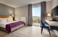 Bedroom 7 Ramada by Wyndham Muenchen Airport