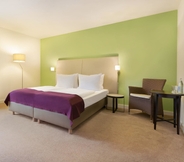 Bedroom 4 Ramada by Wyndham Muenchen Airport