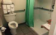 In-room Bathroom 6 Days Inn & Suites by Wyndham Poteau