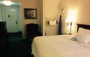 Bedroom 7 Days Inn & Suites by Wyndham Poteau