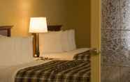 Bedroom 7 Merit Hotel & Suites