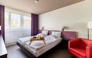 Kamar Tidur 7 Hotel Les Nations