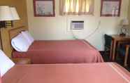 Kamar Tidur 7 Caravan Motel