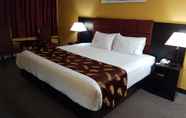 Bedroom 6 Alpine Inn & Suites