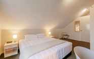 Kamar Tidur 4 Le Chalet Suisse Motel Apartments