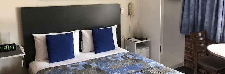 Kamar Tidur Golden Grain Motor Inn