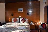 Bedroom Welcome Hotel at Gulmarg