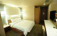 Kamar Tidur 3 Kindness Hotel Sanduo Shopping District