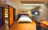 Bedroom 2 Friendly DH Naissance Hotel by Mindrum Group