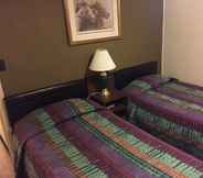 Bedroom 5 Rodeway Inn & Suites - Charles Town, WV