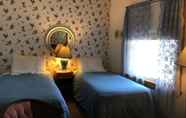 Kamar Tidur 5 10th Avenue Guest House & Suites