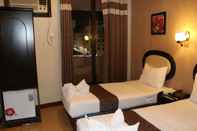 Bedroom Grand Sina Hotel