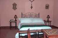Phòng ngủ Posada del Puruay