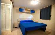 Kamar Tidur 4 Villaggio Camping Blu