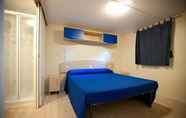 Bedroom 4 Villaggio Camping Blu