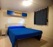 Bedroom 4 Villaggio Camping Blu