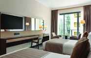 Bedroom 2 Hawthorn Suites by Wyndham Abu Dhabi City Centre