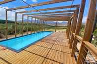 Swimming Pool Endless Vineyards at Wildekrans Wine Estate